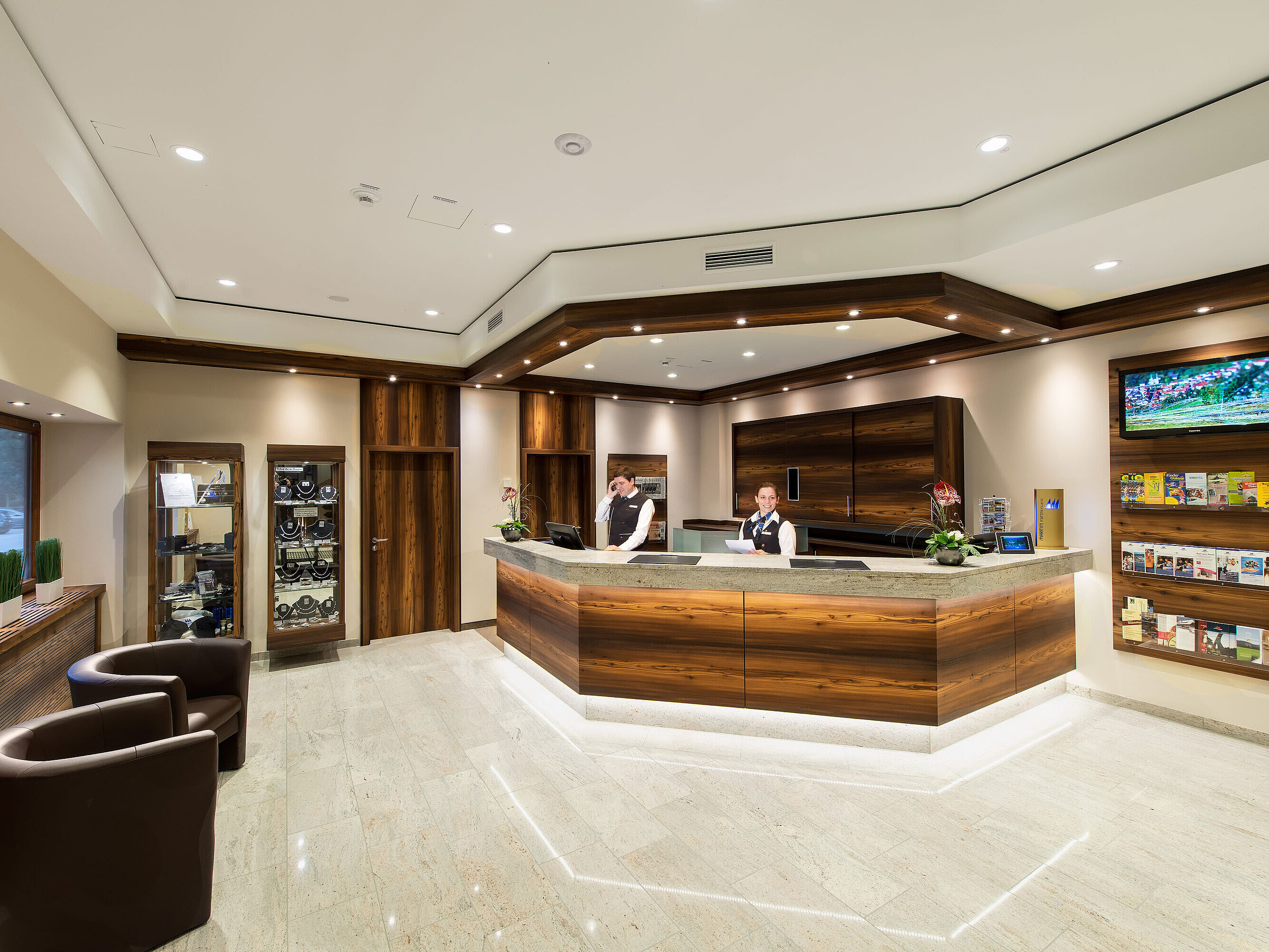 Reception area at Maritim Hotel Titisee with wood design and friendly staff