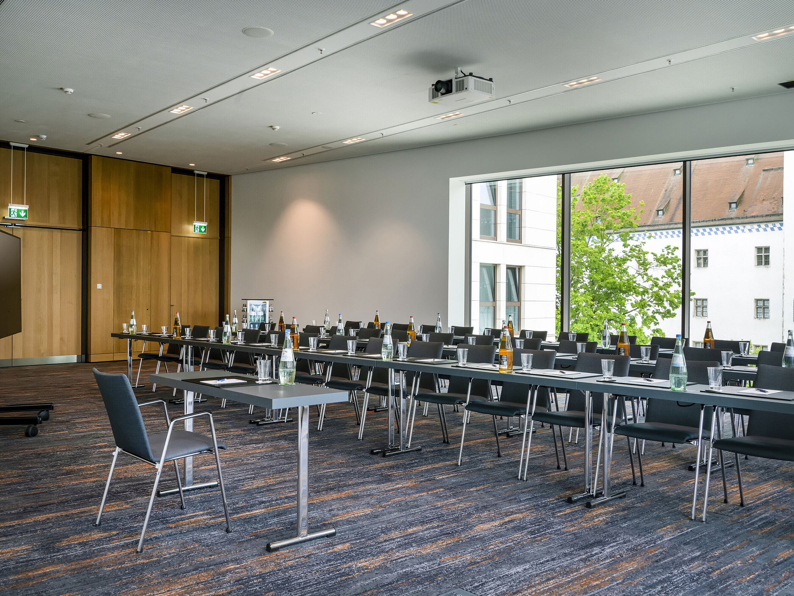 Bright meeting room at Maritim Hotel Ingolstadt with modern equipment and view.