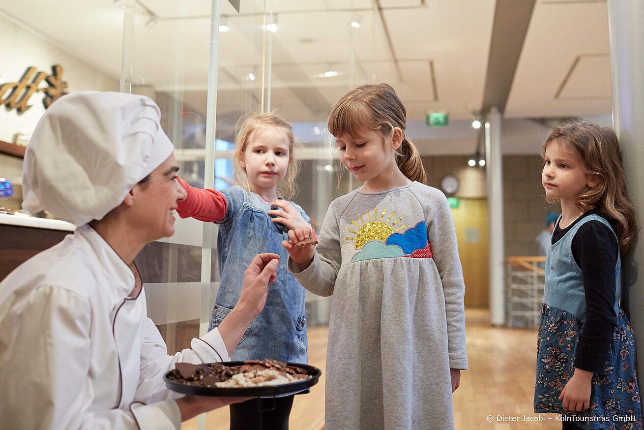 Chocolate Museum Children tasting sweets with baker or pastry chef