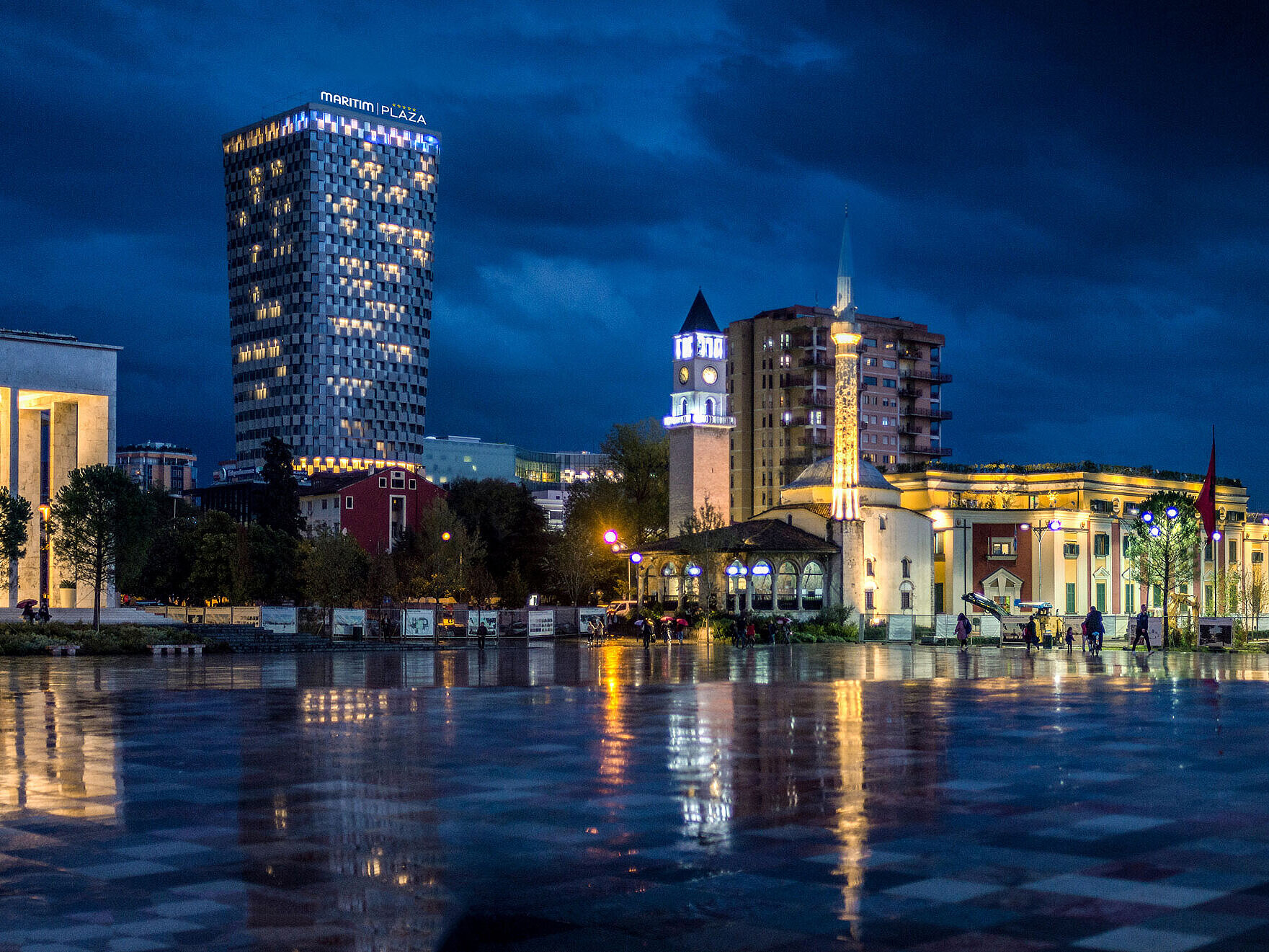 Night view of Skanderbeg Square with illuminated Maritim Hotel Plaza Tirana in the background