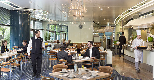 Guests enjoying breakfast at the stylish Ambiente restaurant at Maritim Hotel Frankfurt.