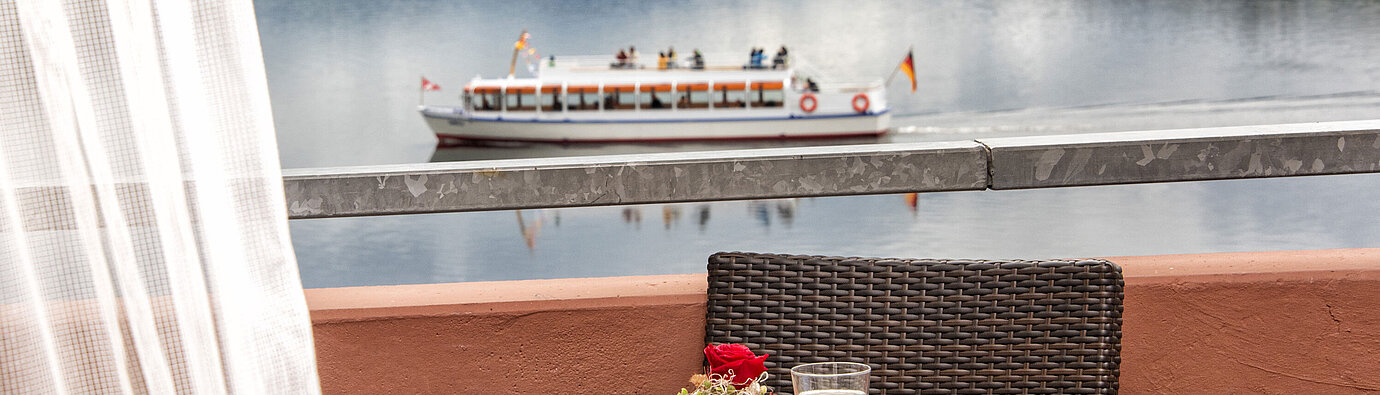 Balcony with lake view and passing boat on Lake Titisee at Maritim TitiseeHotel