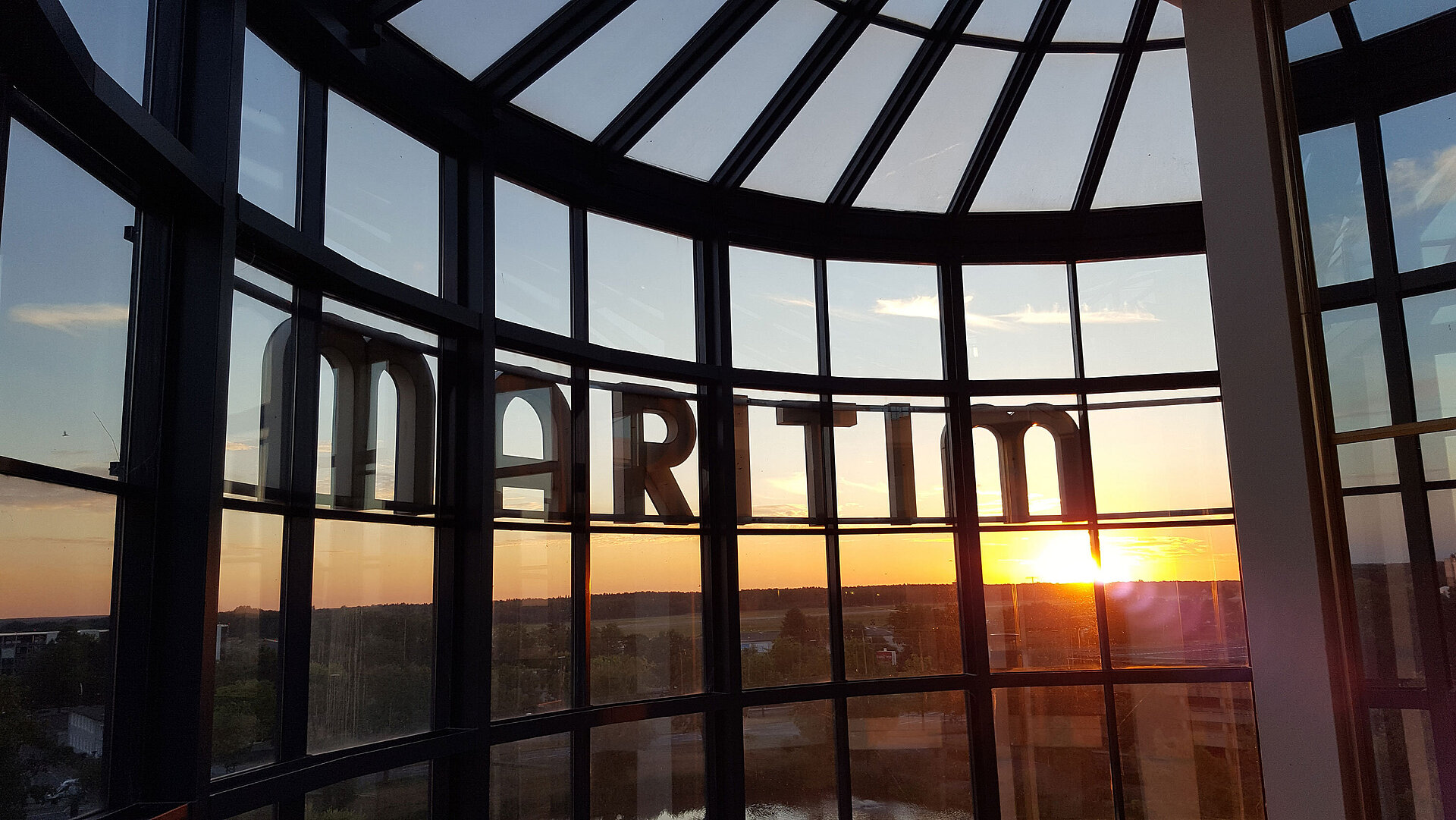 Spectacular sunset view through the glass facade of Maritim Hotel Hannover.