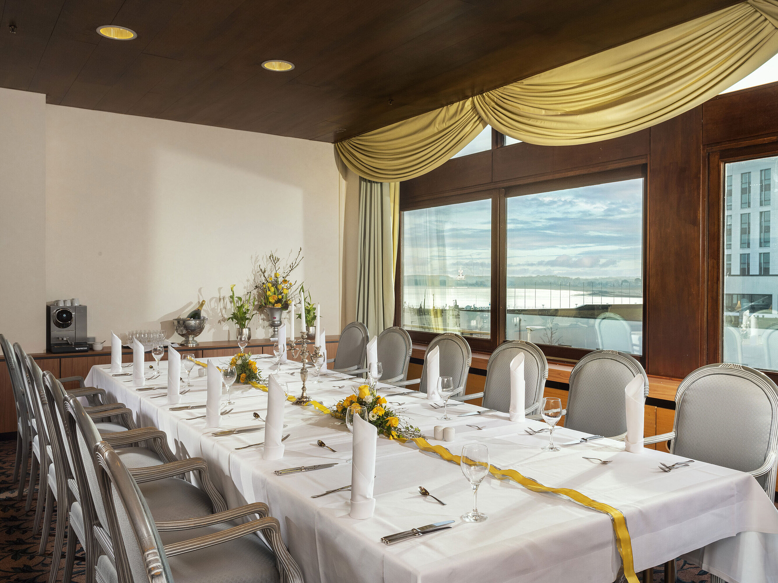 Elegantly set dining room at Maritim Hotel Travemünde with lake view