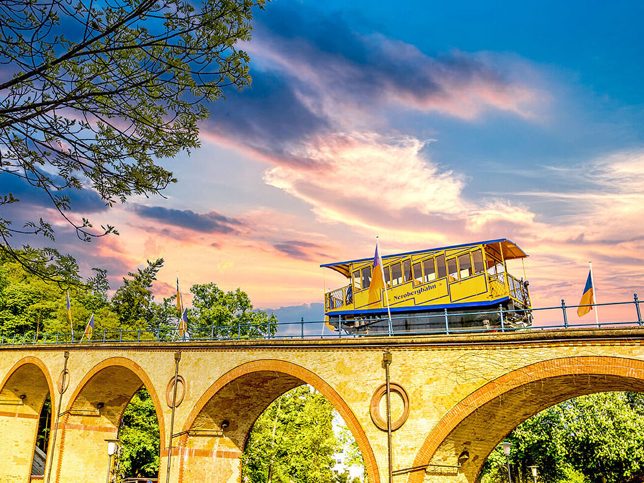 Historic Nerobergbahn funicular crossing bridge to Neroberg in Wiesbaden at sunset