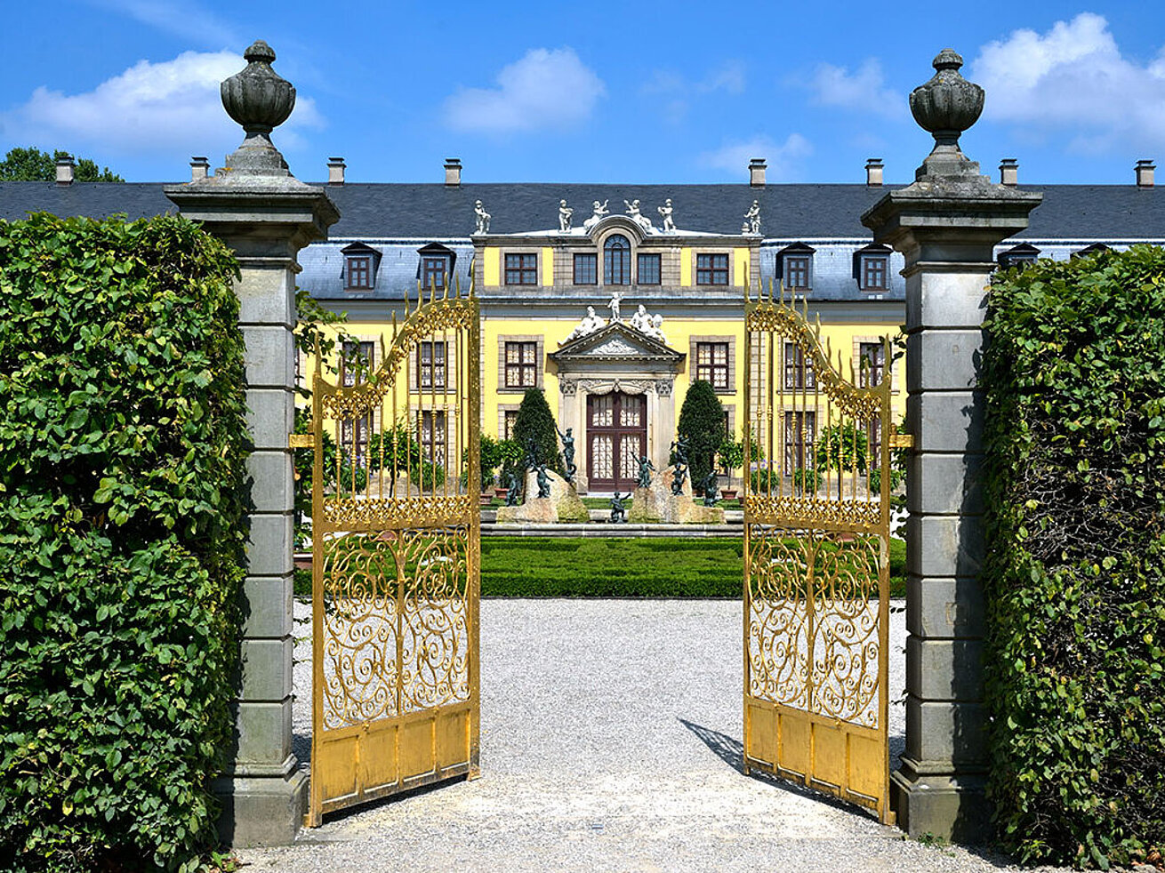 Open golden gate with view of the baroque Herrenhausen Palace in Hanover