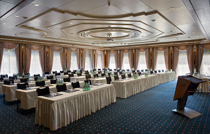 Conference hall with stage, daylight and modern setup at Maritim Hotel Bad Salzuflen
