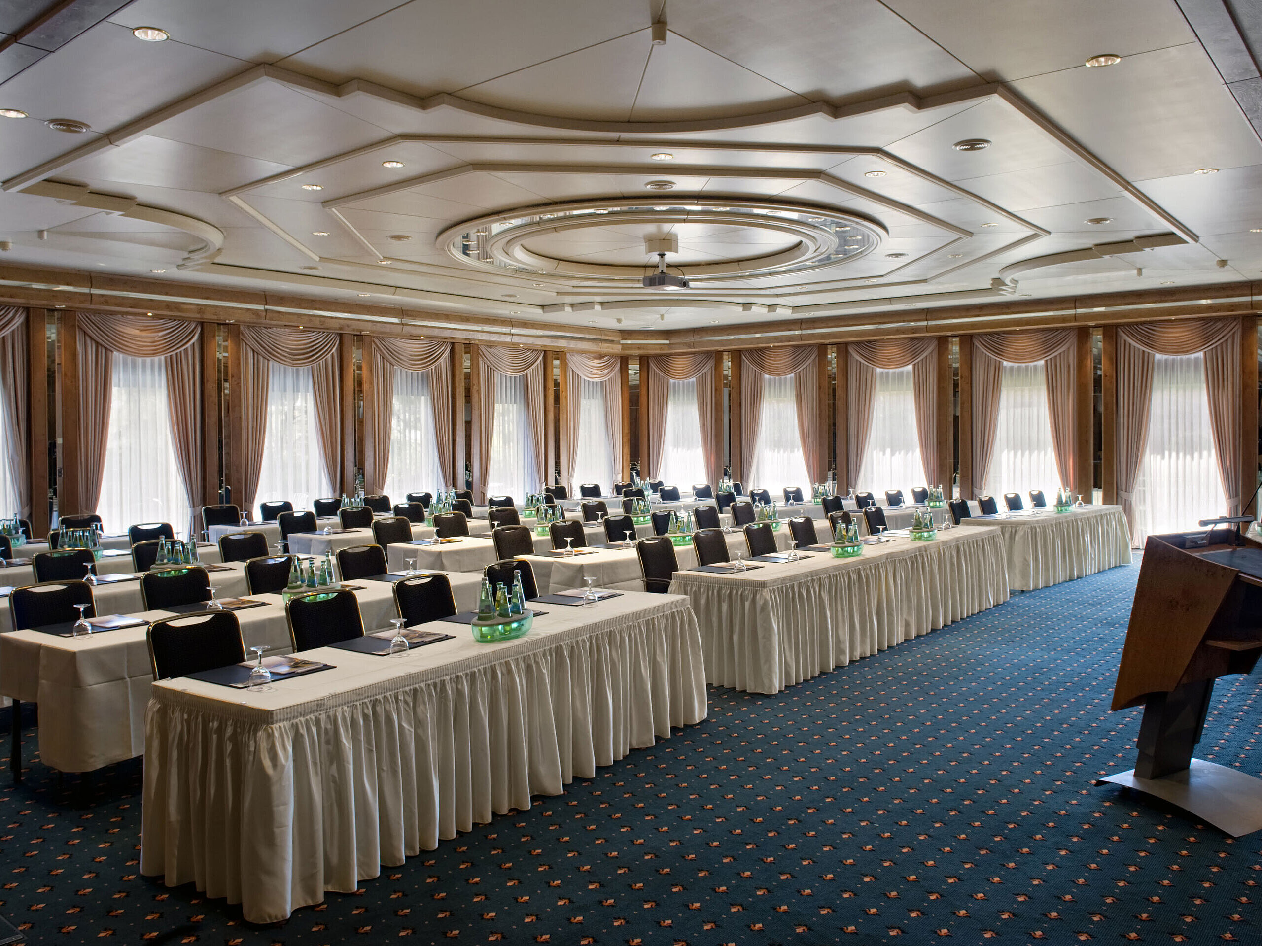 Conference hall with stage, daylight and modern setup at Maritim Hotel Bad Salzuflen