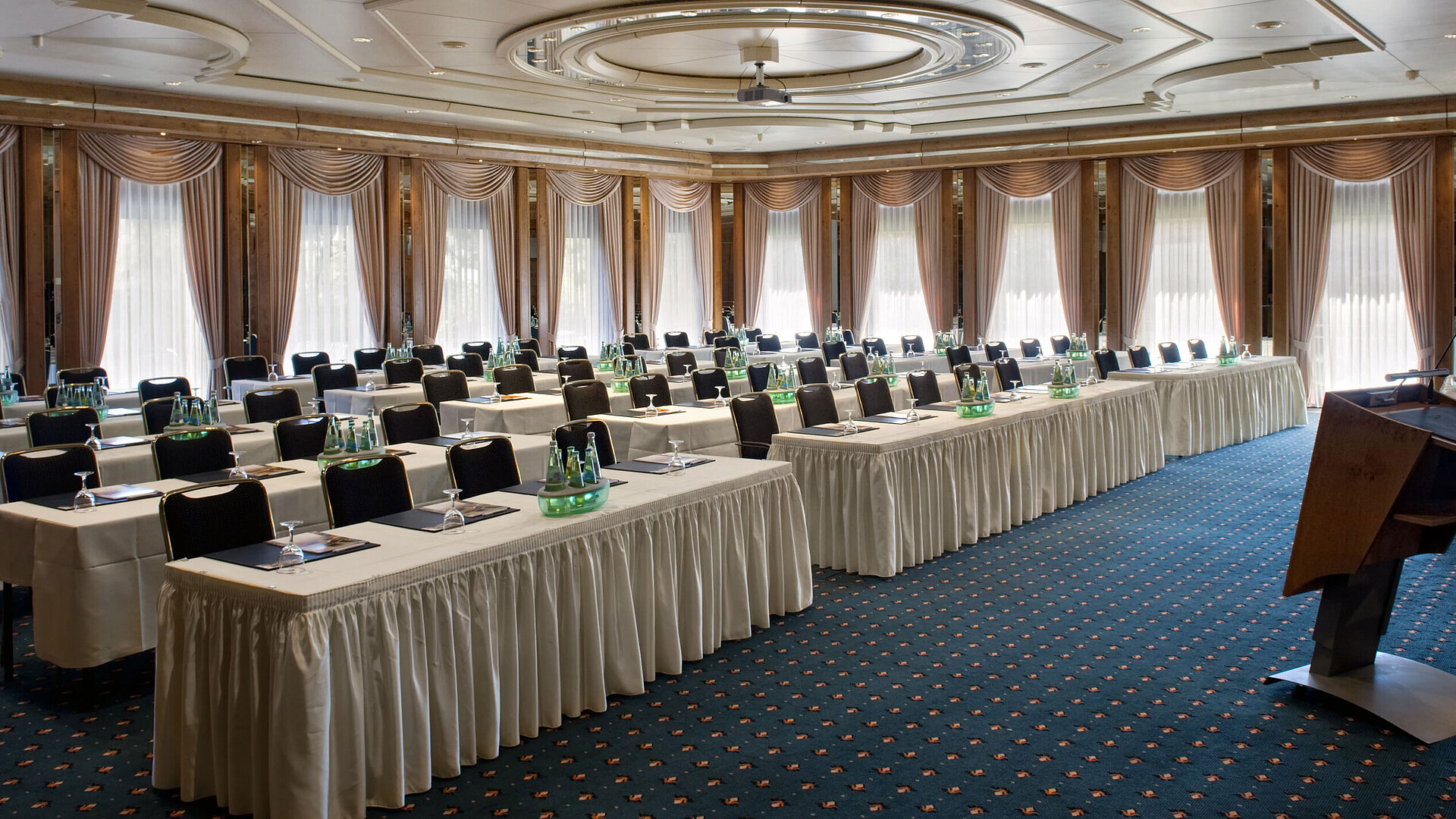 Conference hall with stage, daylight and modern setup at Maritim Hotel Bad Salzuflen