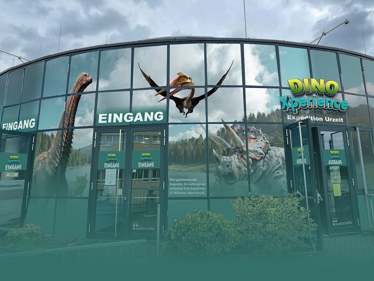 DinoXperience museum with dinosaur images on modern building façade