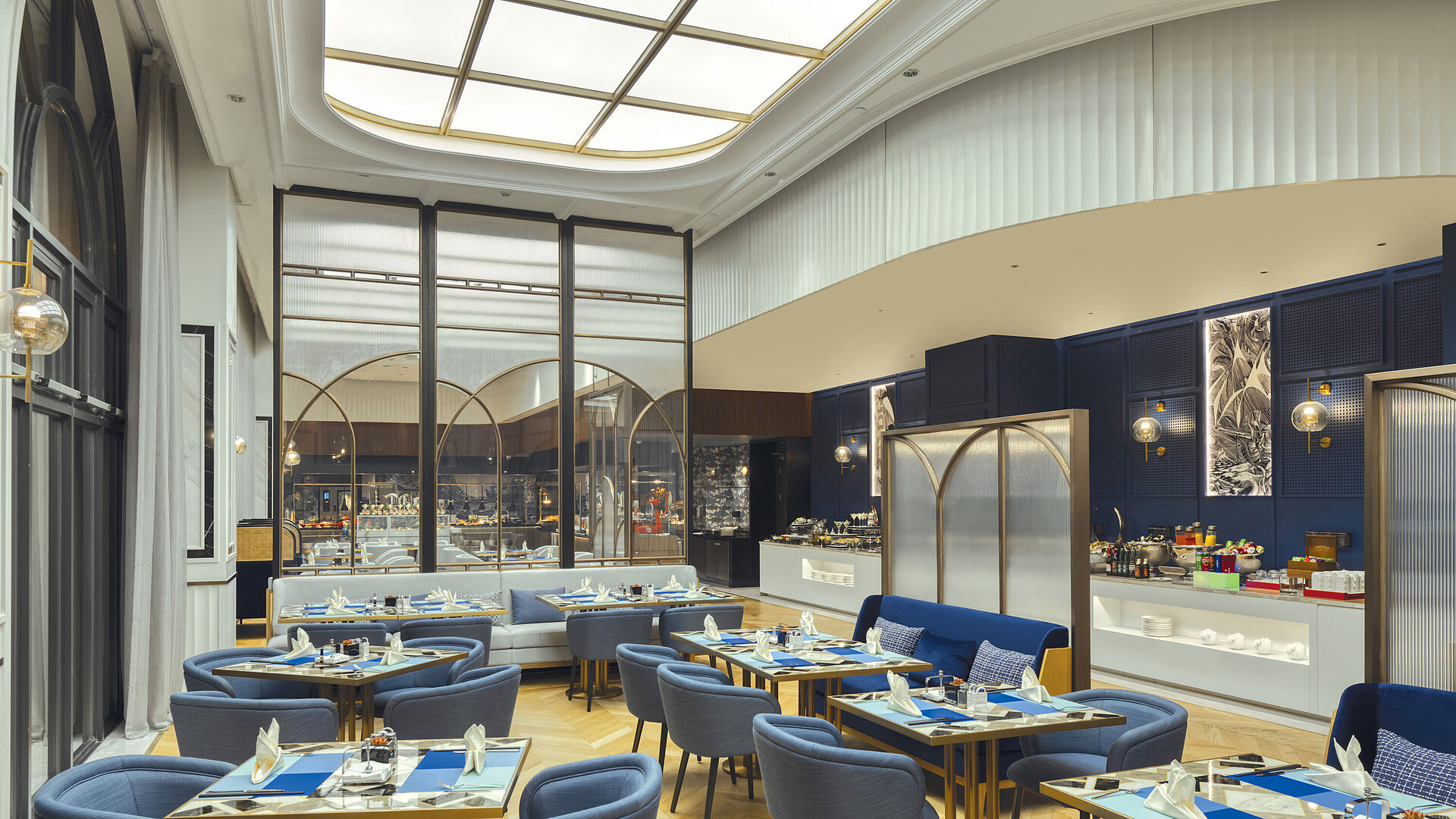 Elegant restaurant area with modern furniture and view of the buffet station at Maritim Hotel Taicang