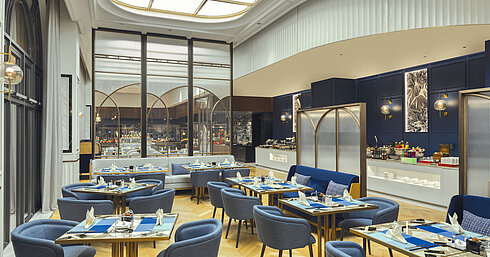 Elegant restaurant area with modern furniture and view of the buffet station at Maritim Hotel Taicang