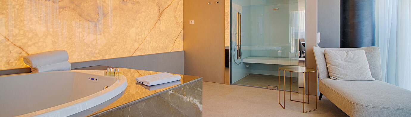 Elegant spa suite with whirlpool and loungers at the Maritim Hotel Plaza Tirana
