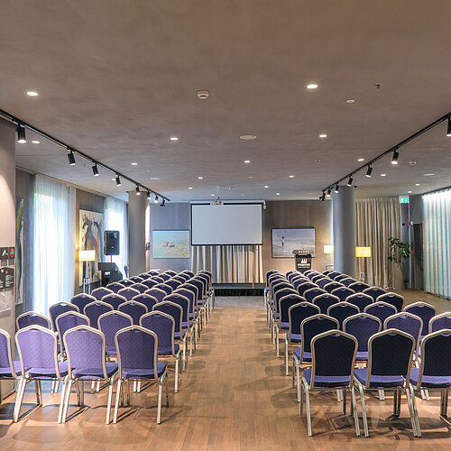 Bright event space at Maritim Hotel Plaza Tirana with theatre seating and screen