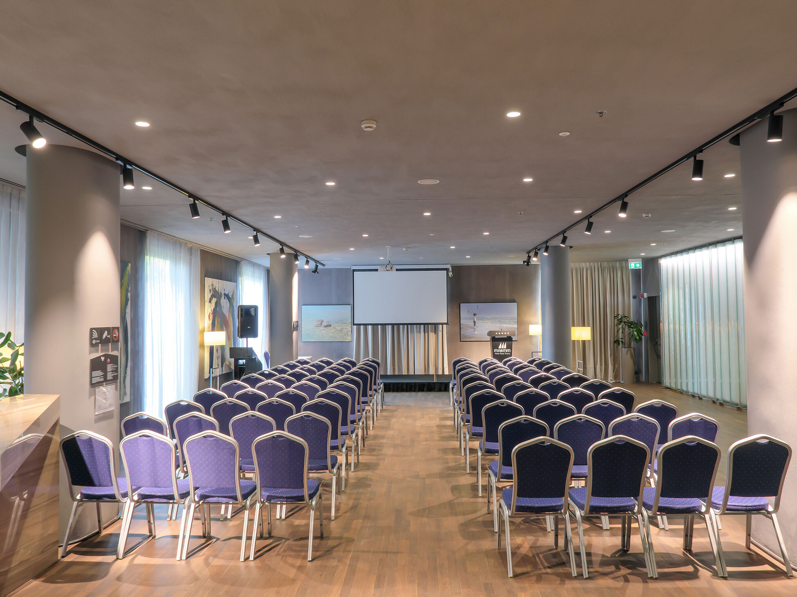 Bright event space at Maritim Hotel Plaza Tirana with theatre seating and screen