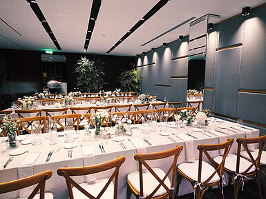 Elegant banquet hall at Maritim Resort Marina Bay with floral décor and long arranged tables