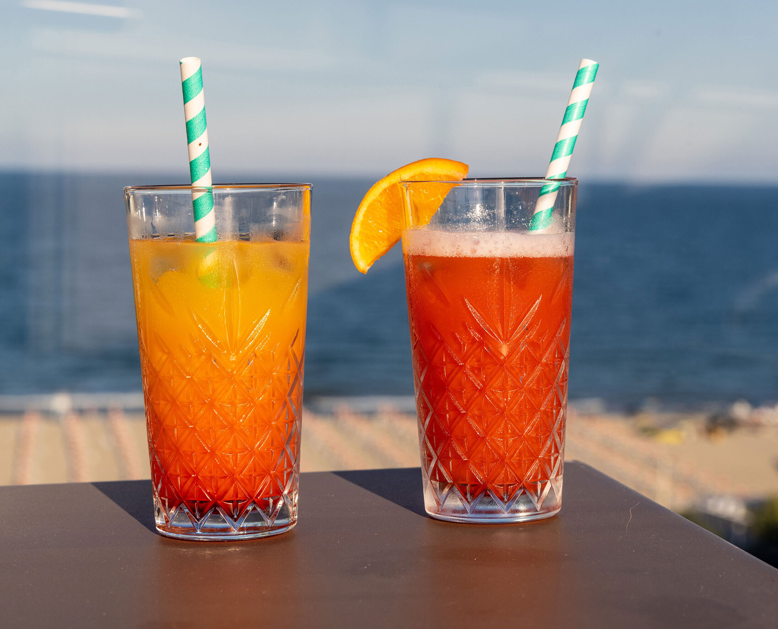 Two colourful summer drinks at Maritim Hotel Amelia with a view of the beach and sea