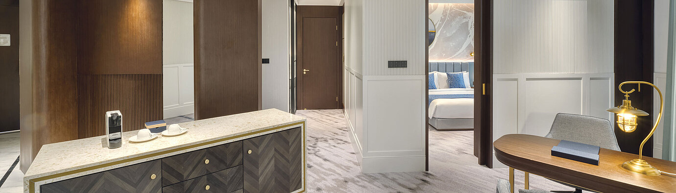 Elegant suite with separate living and sleeping areas and modern design at Maritim Hotel Taicang