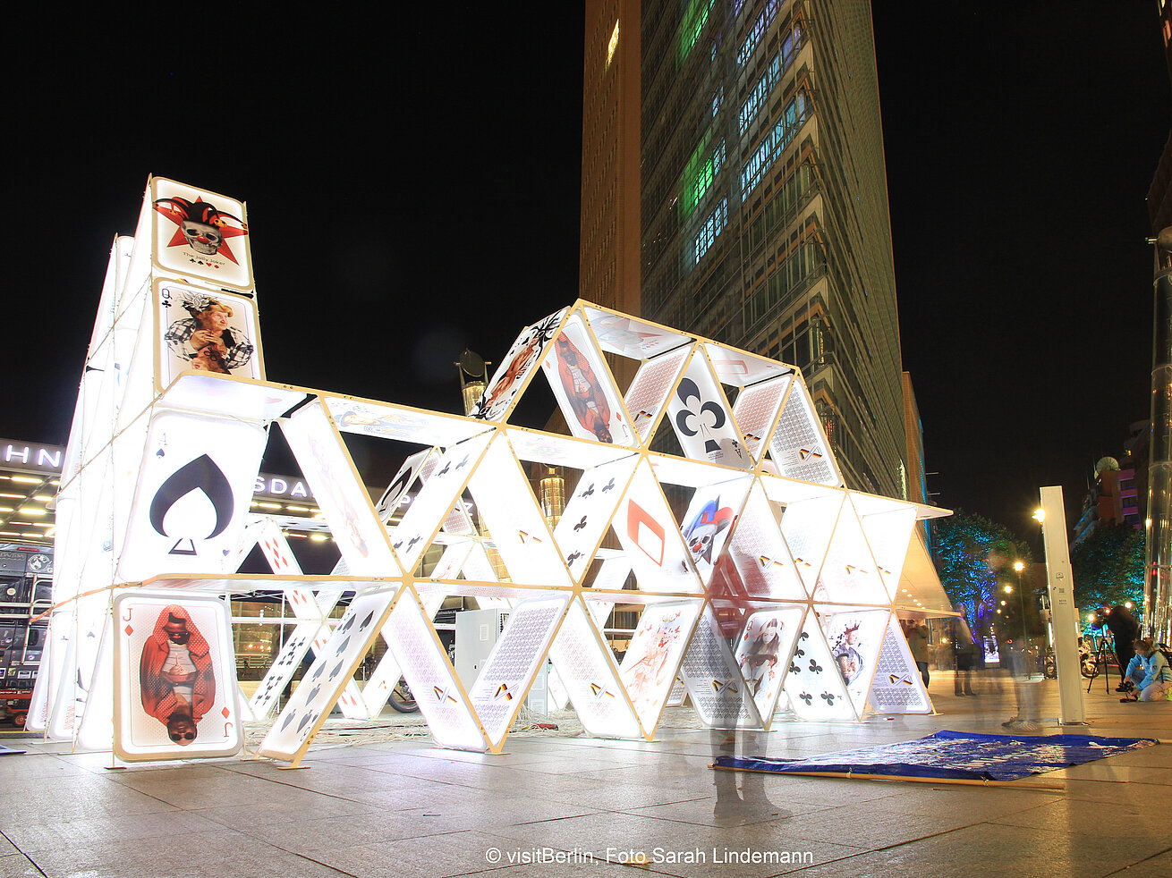 Illuminated house of cards installation at Potsdamer Platz Berlin at night