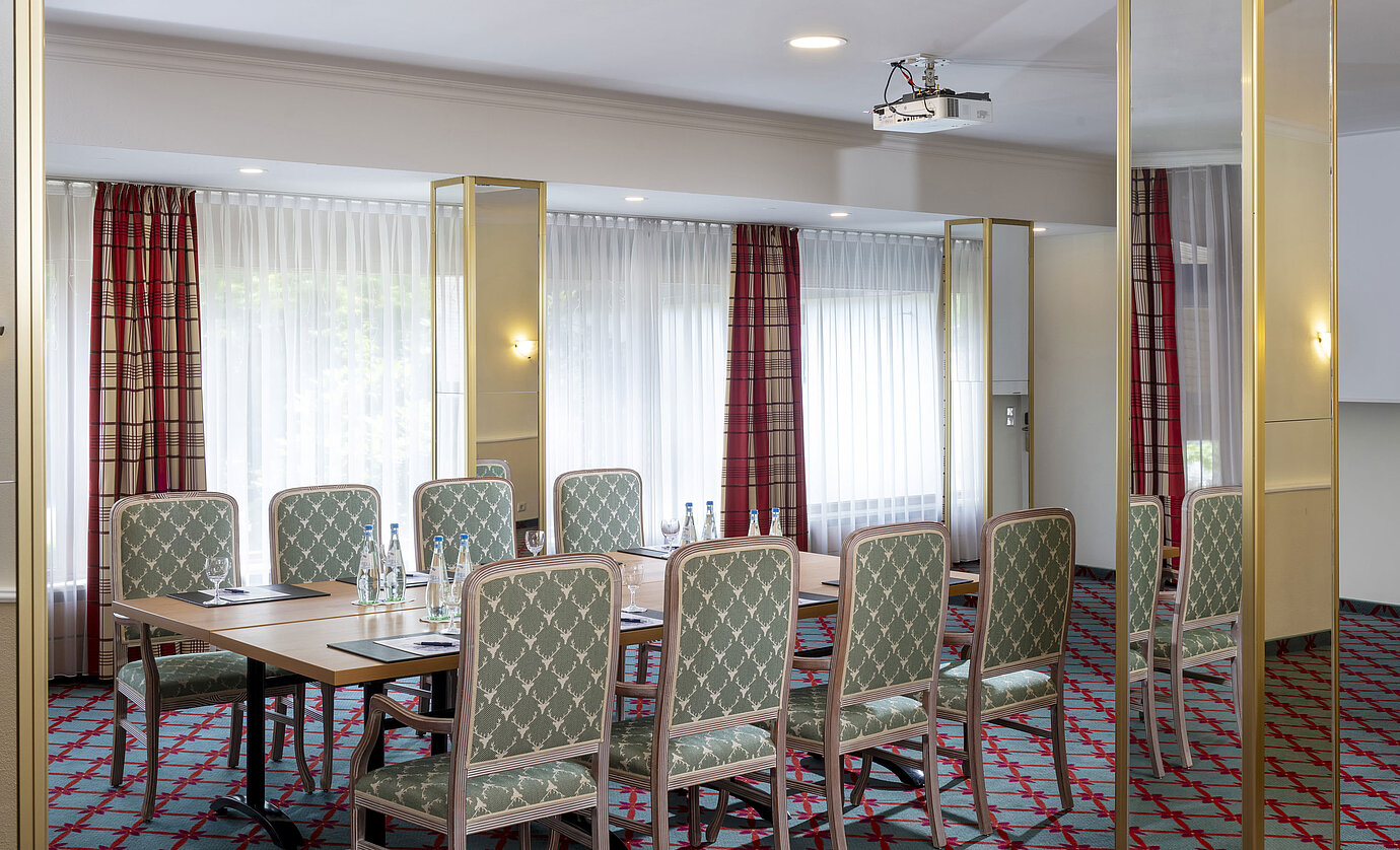 Small conference room with elegant seating at Maritim Hotel Titisee
