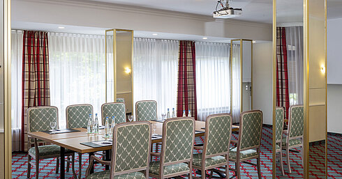 Small conference room with elegant seating at Maritim Hotel Titisee
