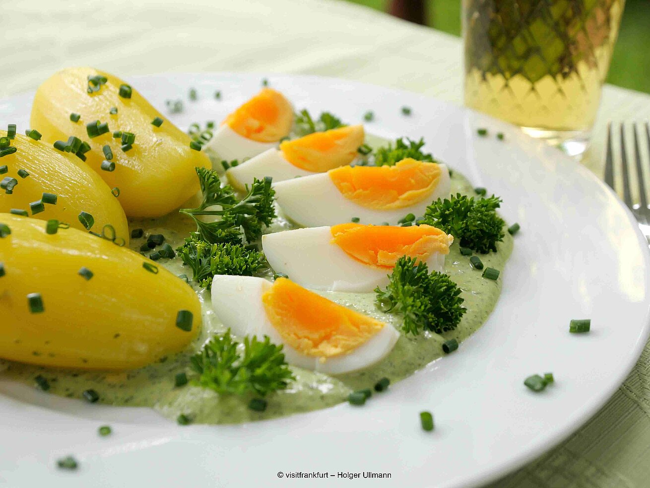 Frankfurt green sauce with potatoes and boiled eggs served on a white plate