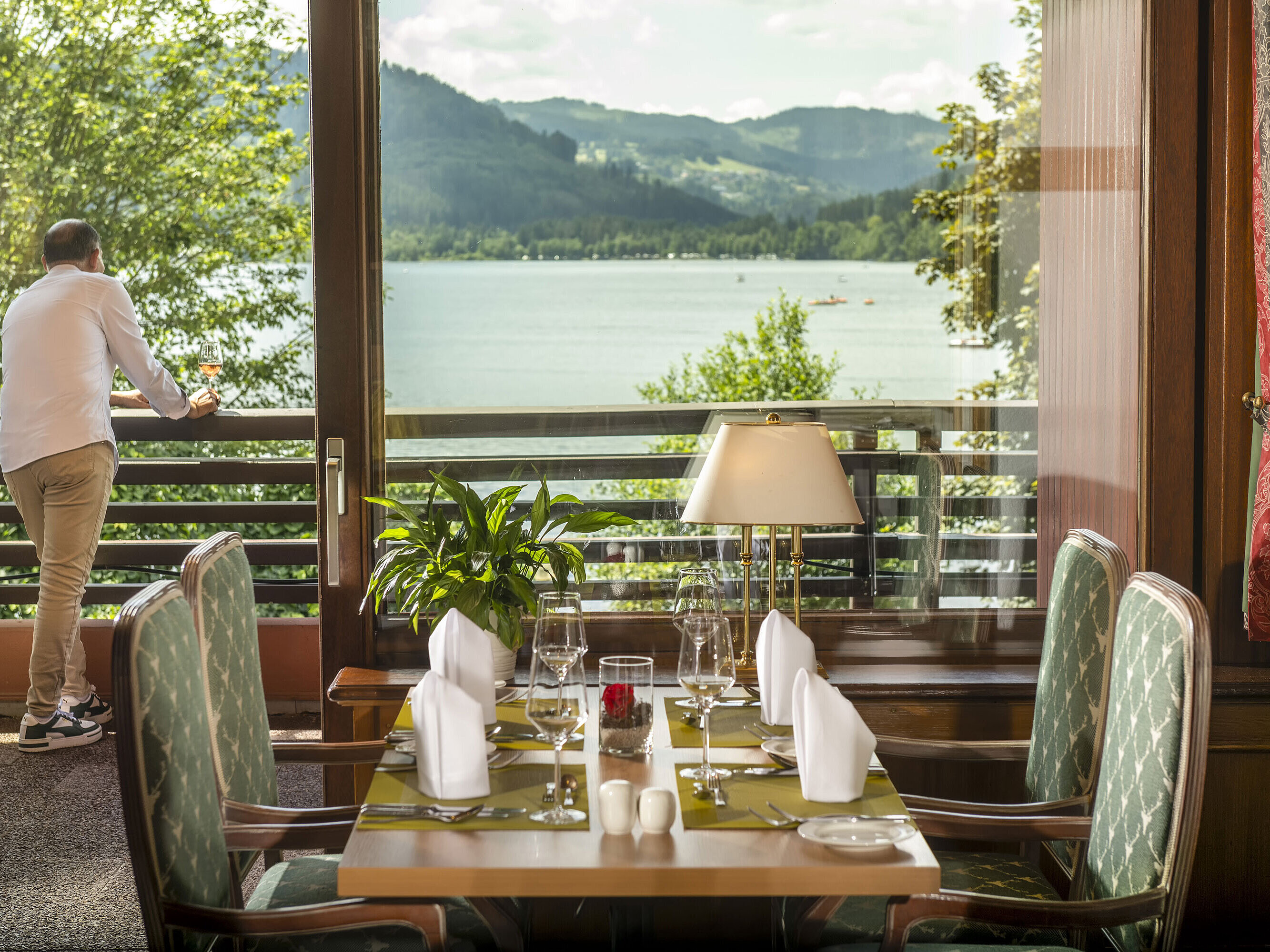 Restaurant at Maritim Hotel Titisee with lake view and set dining table