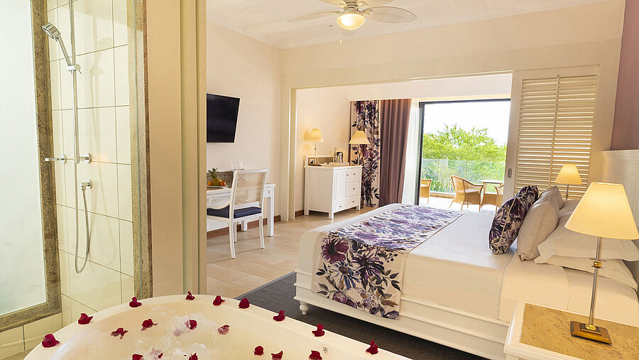 Bright bathroom with freestanding bathtub, shower, and modern amenities