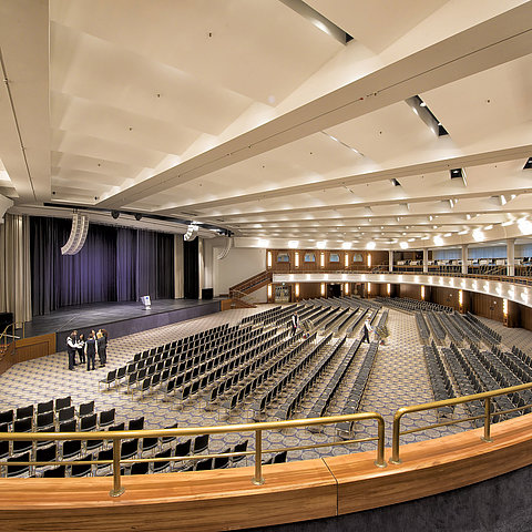 Maritim Hall at Maritim Hotel Bonn, with row seating and a stage, perfect for conferences and large events.