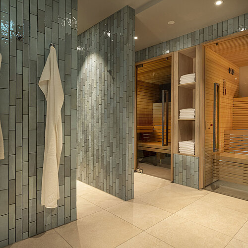 Modern sauna area with towels and bathrobes at the Maritim Hotel Munich