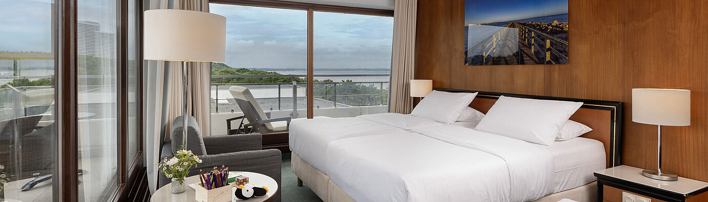 Bright family room at Maritim Seehotel Timmendorfer Strand with balcony and Baltic Sea view