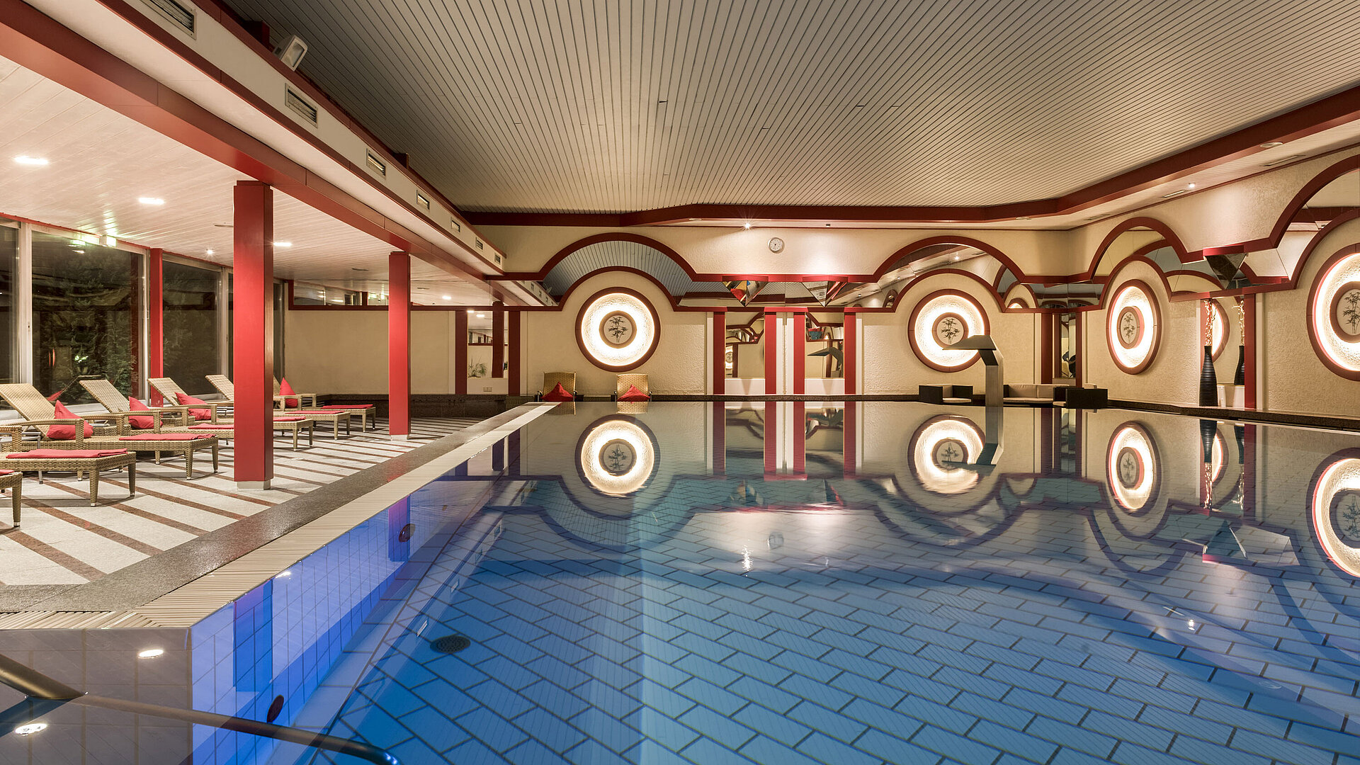 Spa area with loungers and large indoor pool at Maritim Hotel Bad Wildungen