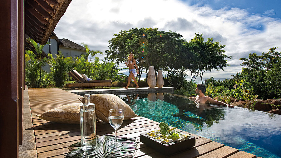 Private pool villa with infinity pool, sun deck and tropical garden with sea view