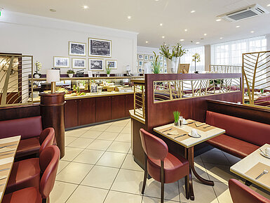 Stylish breakfast restaurant with buffet, set tables and comfortable seating areas