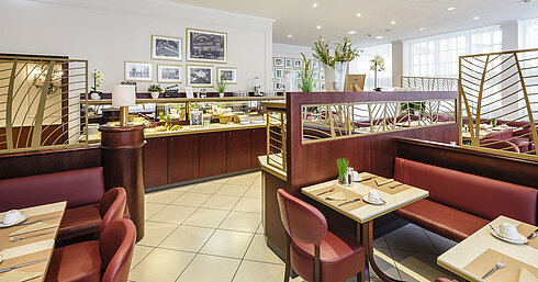 Stylish breakfast restaurant with buffet, set tables and comfortable seating areas