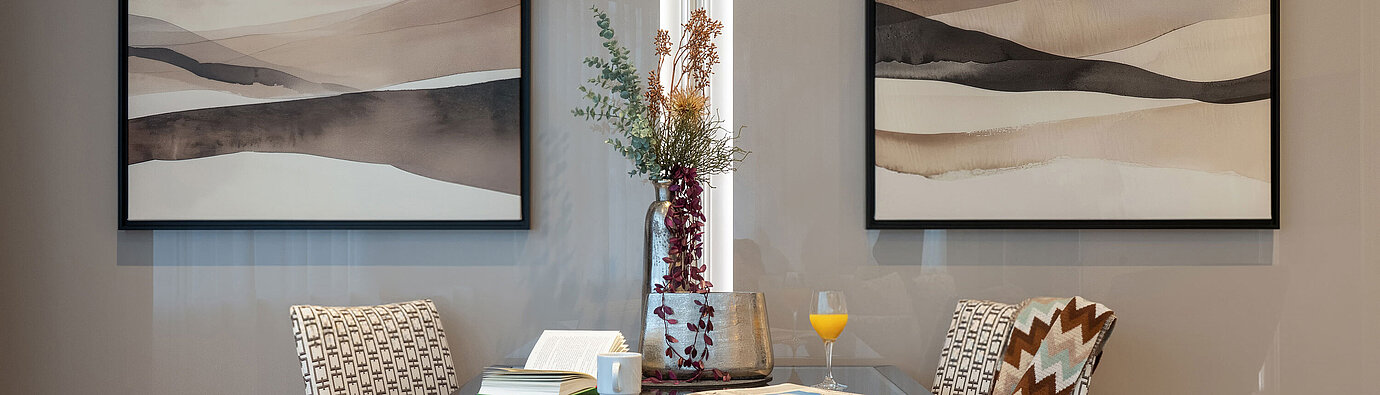 Suite with a small dining area, table for two, elegant armchairs and a harmonious, classic interior.