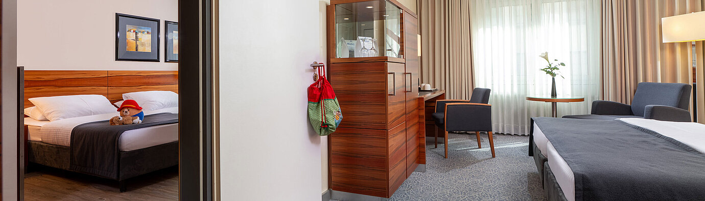 Two connected Classic rooms with bright design at the Maritim Hotel München.