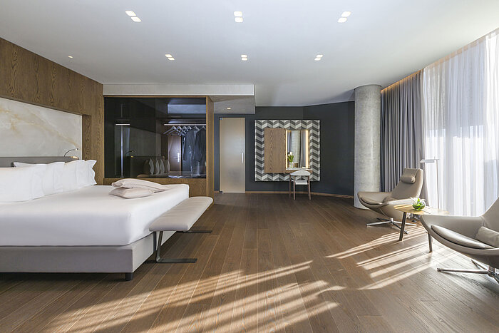 Modern room with mirror, designer furniture and elegant interior at Maritim Hotel Plaza Tirana