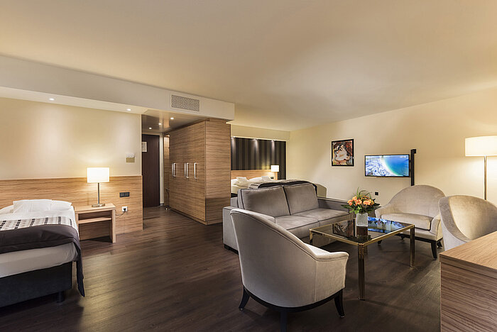Hotel room for allergy sufferer Elegant suite at Maritim Hotel Königswinter with modern living area and luxurious furnishings.