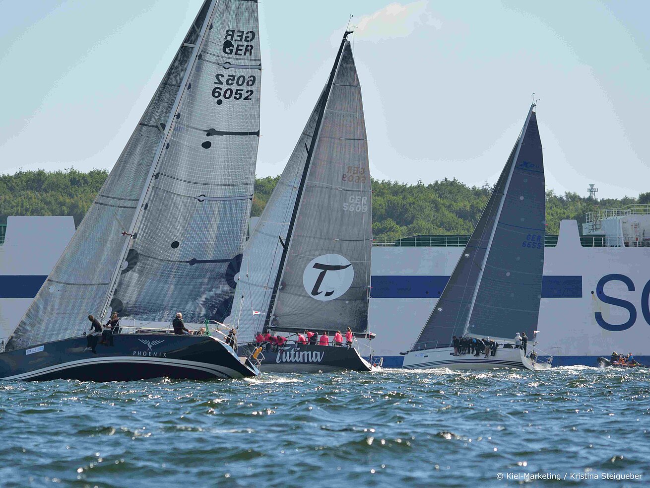 Sailing regatta with several yachts on the Baltic Sea on sunny day