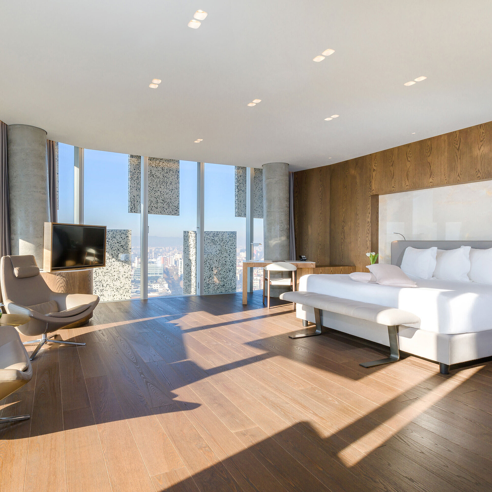 Bright panorama suite with city view and designer furniture at Maritim Hotel Plaza Tirana