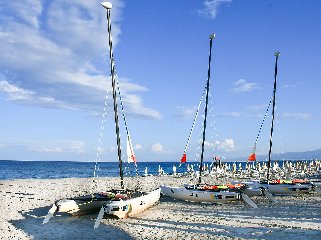 Catamarans on the beach of Maritim Resort Calabria with sea view.