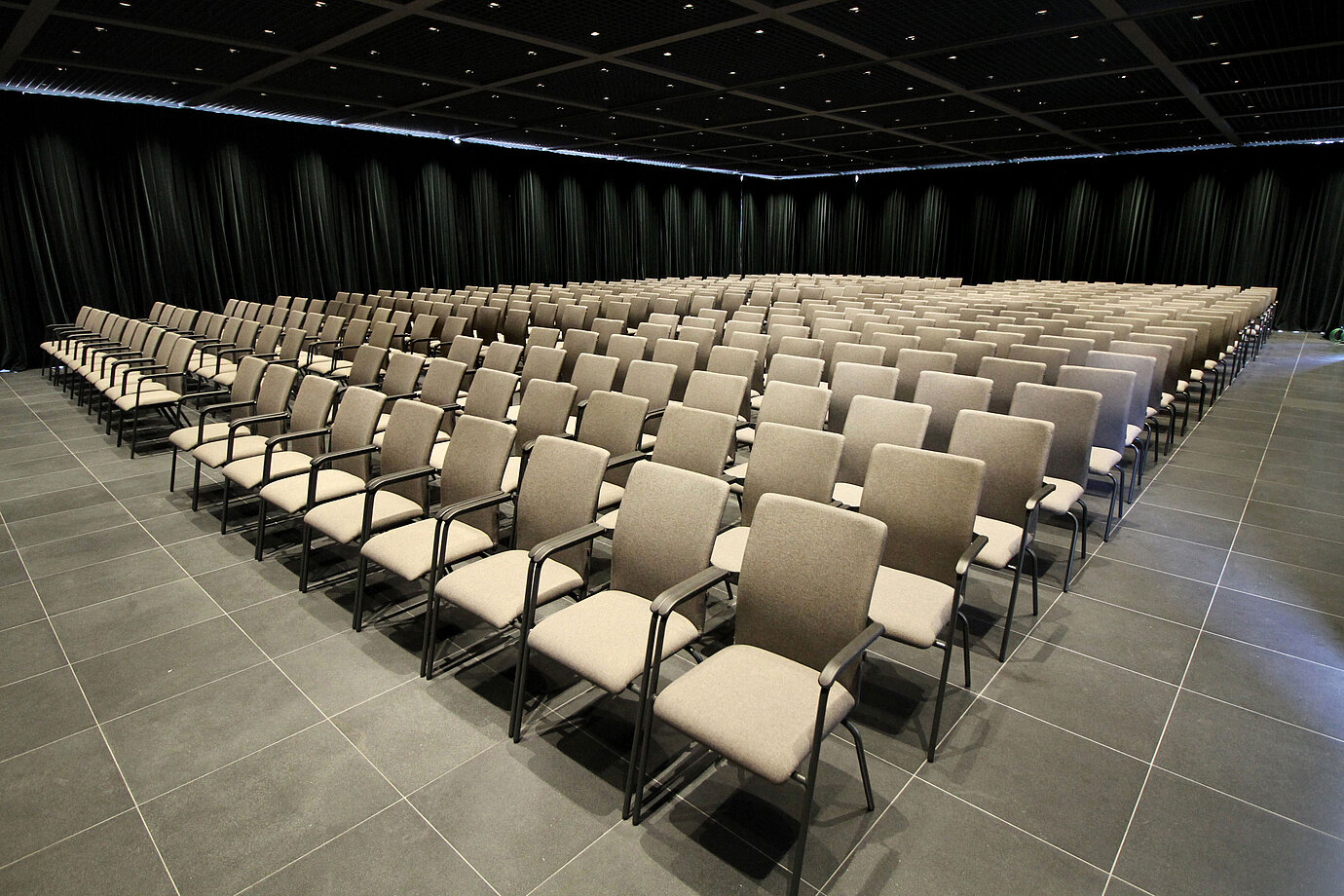 Large conference hall with row seating and stage view at Maritim Hotel Plaza Tirana