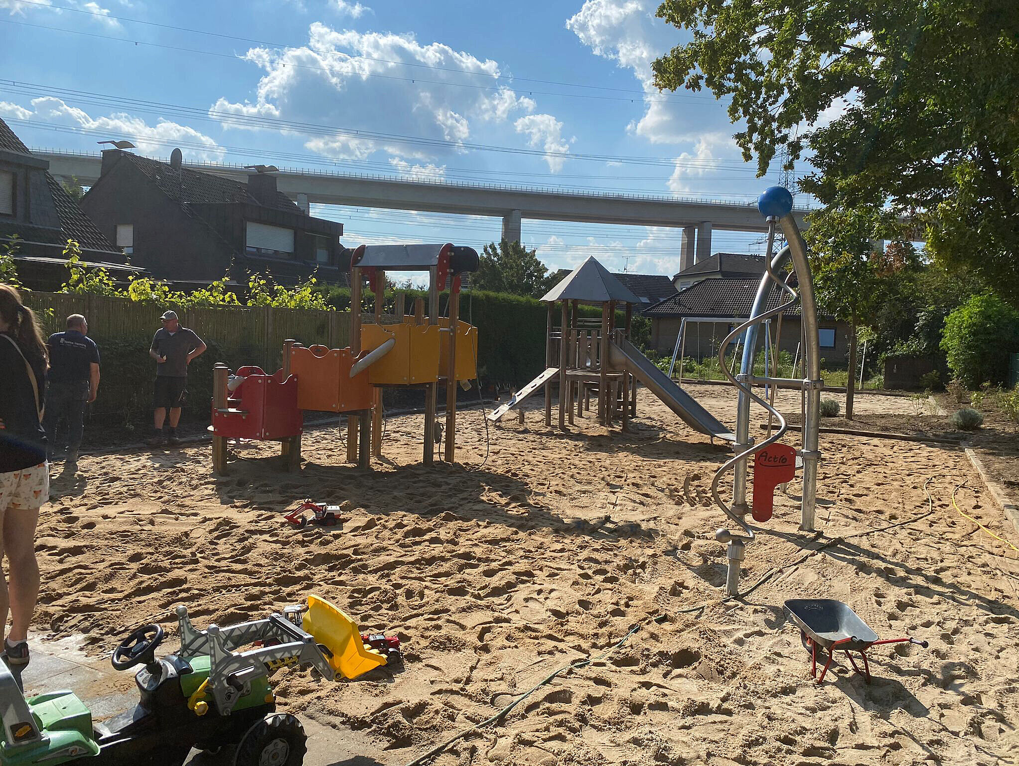 Playground reconstruction after flooding Rebuilt playground with sand area and play equipment following restoration after severe flooding