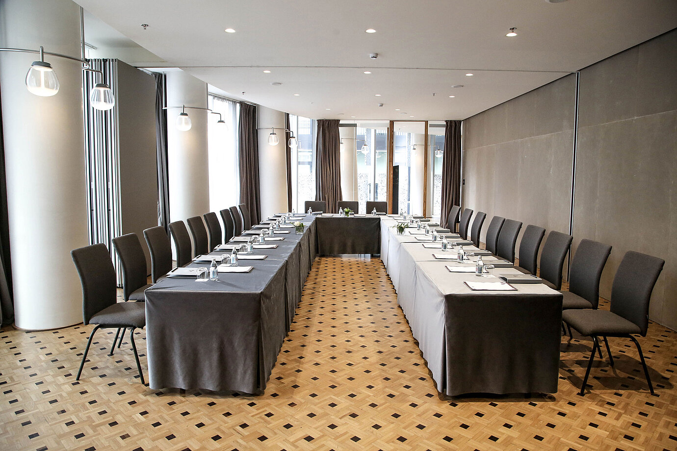 Modern conference room at Maritim Hotel Plaza Tirana with U-shape seating and natural daylight