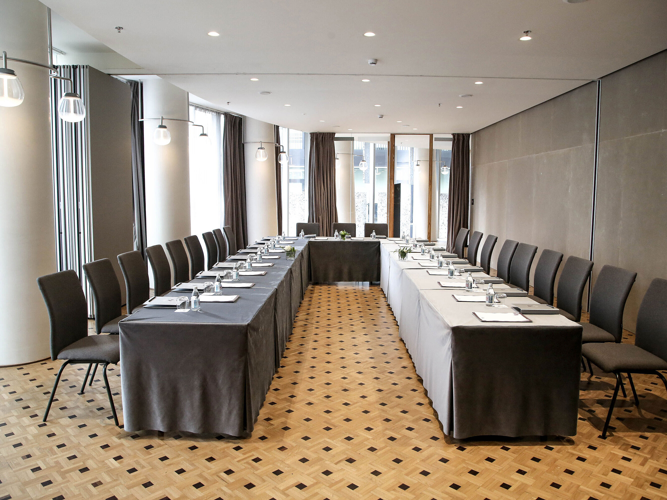 Modern conference room at Maritim Hotel Plaza Tirana with U-shape seating and natural daylight
