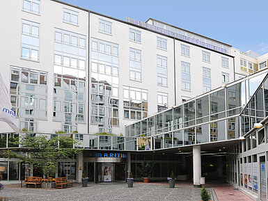 Modern façade with glass details and courtyard of Maritim Hotel Munich