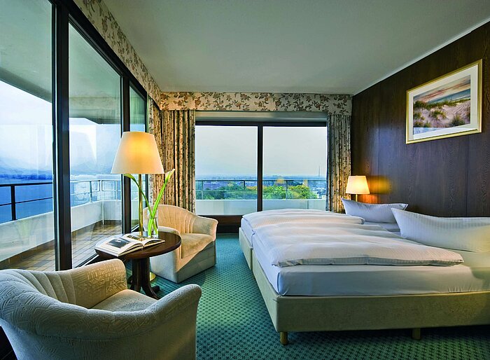 Superior Plus room at Maritim Seehotel Timmendorfer Strand with sea view, balcony, and elegant seating area.