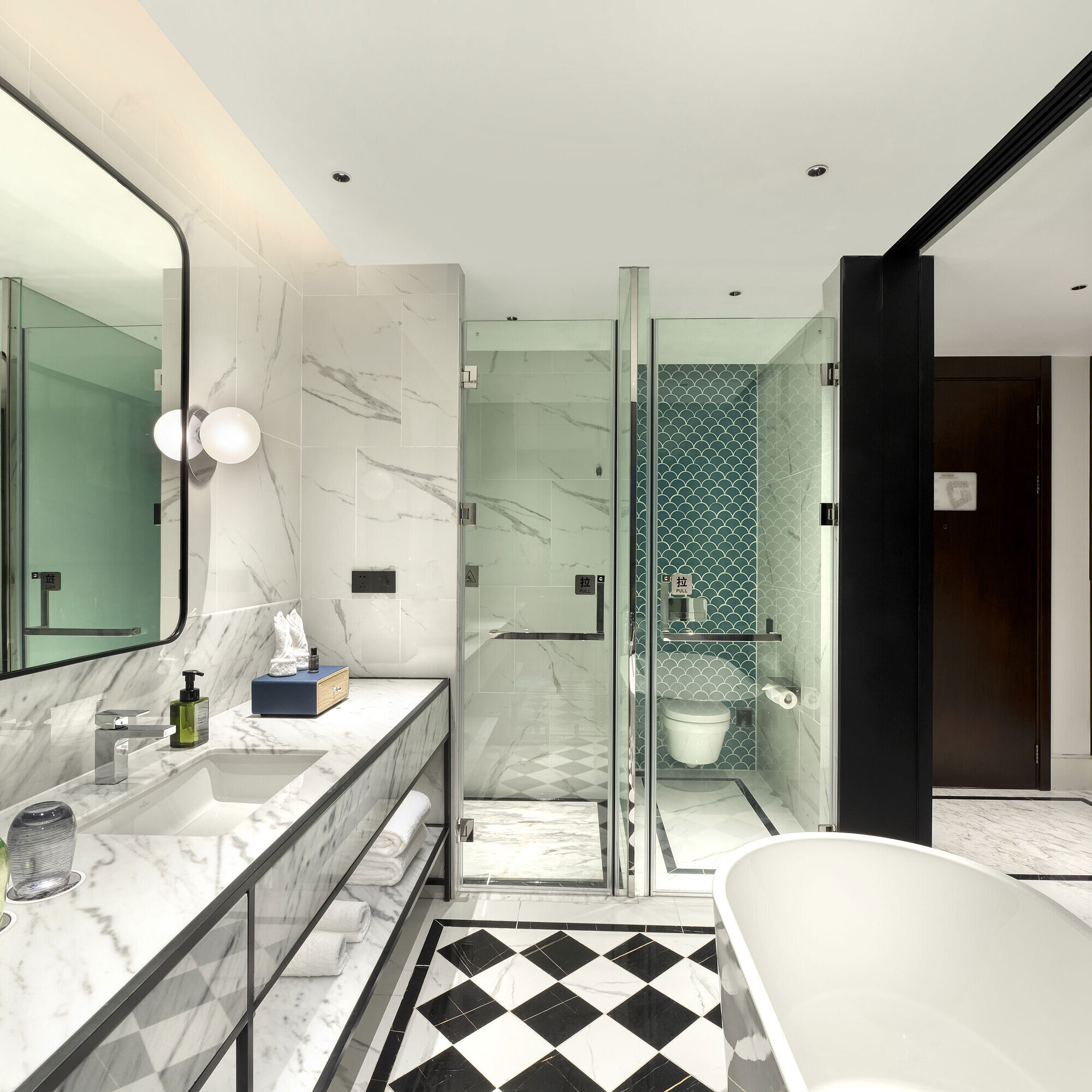 Elegant bathroom with marble design, large shower and modern amenities at Maritim Hotel Taicang