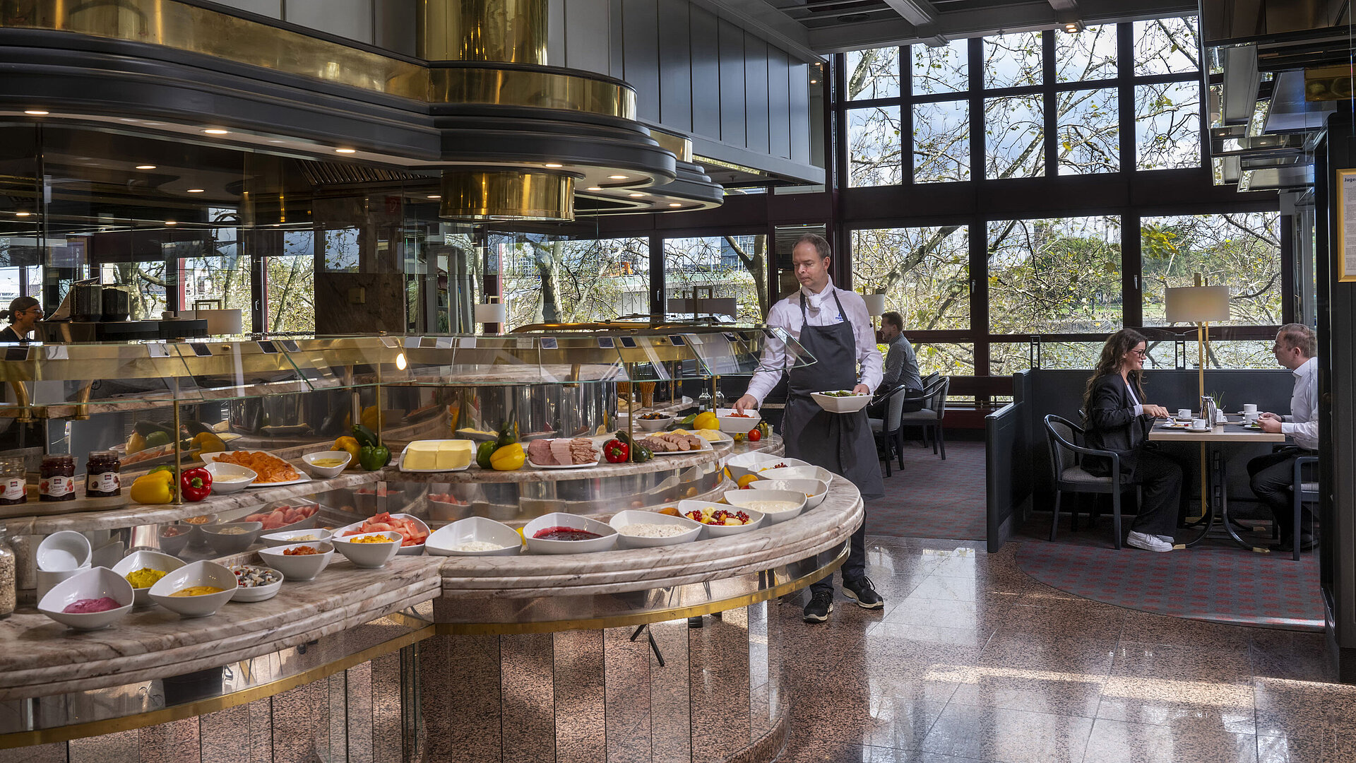 The "Rôtisserie" restaurant at Maritim Hotel Cologne offers a diverse buffet with various dishes to choose from.